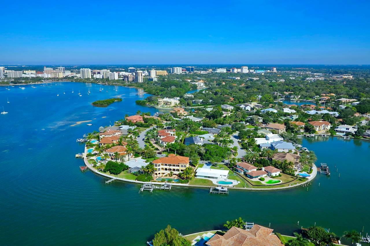 Aerial view of Sarasota homes and Sarasota Bay illustrating Sarasota home values and home equity.